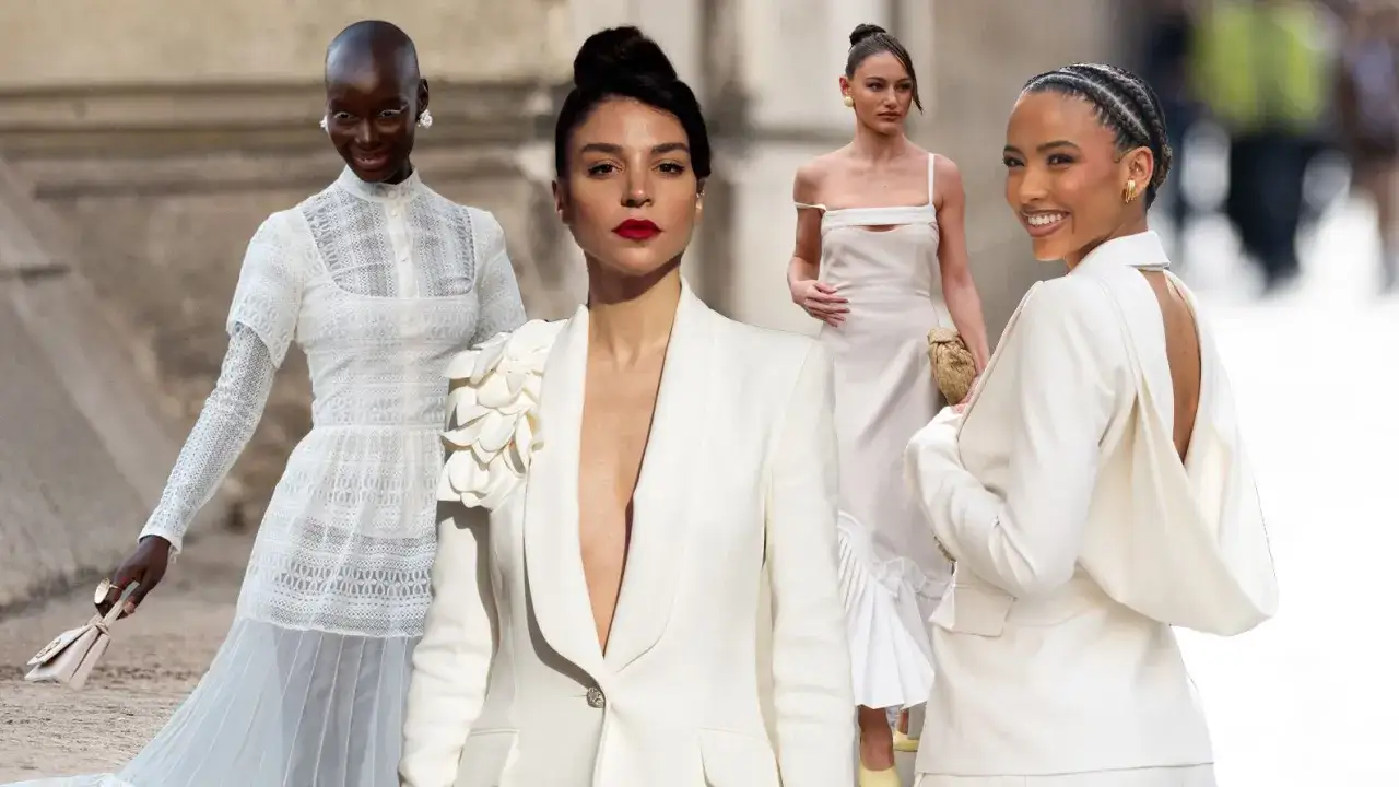 Vier Frauen in eleganten weißen Outfits, bereit für eine standesamtliche Hochzeit im Winter.