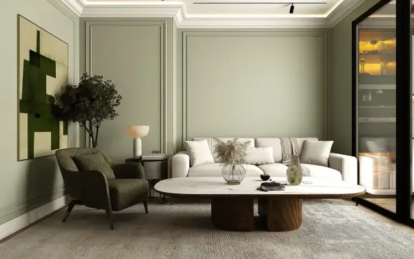 Ein stilvolles japandi style wohnzimmer mit einem beigen Sofa, einem grünen Sessel, einem ovalen Couchtisch und einem abstrakten Bild.